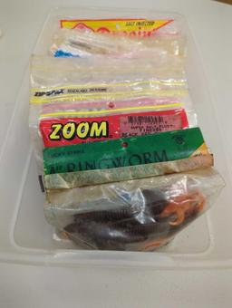 White Rubbermaid organizer tote and contents including worms and other packaged fishing lures. Comes