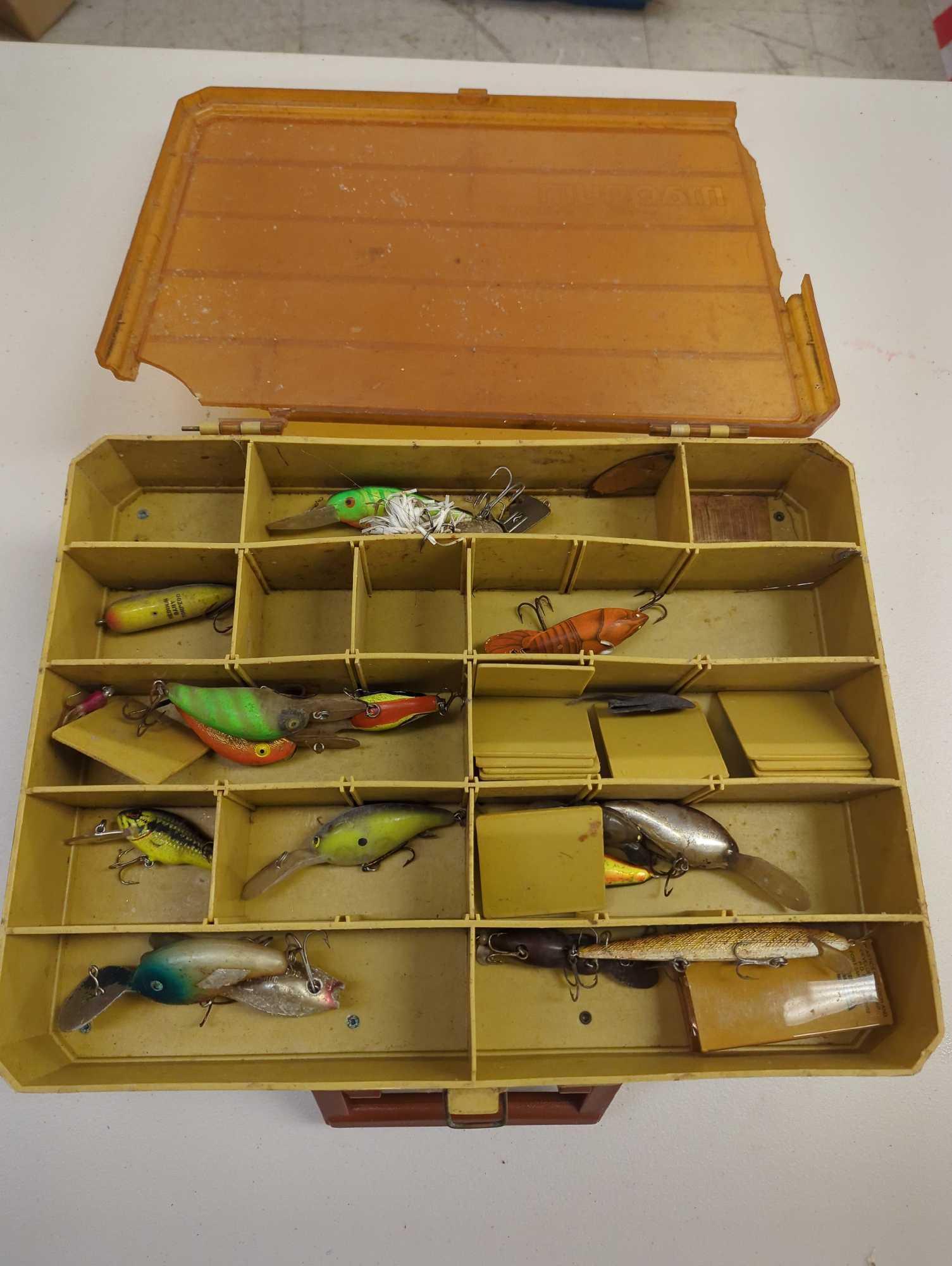 Dual-sided Tackle Box and contents including various fishing lures. Comes as is shown in photos.