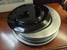 Set of 11 silver plastic charger plates. Comes as is shown in photos. Appears to be used.