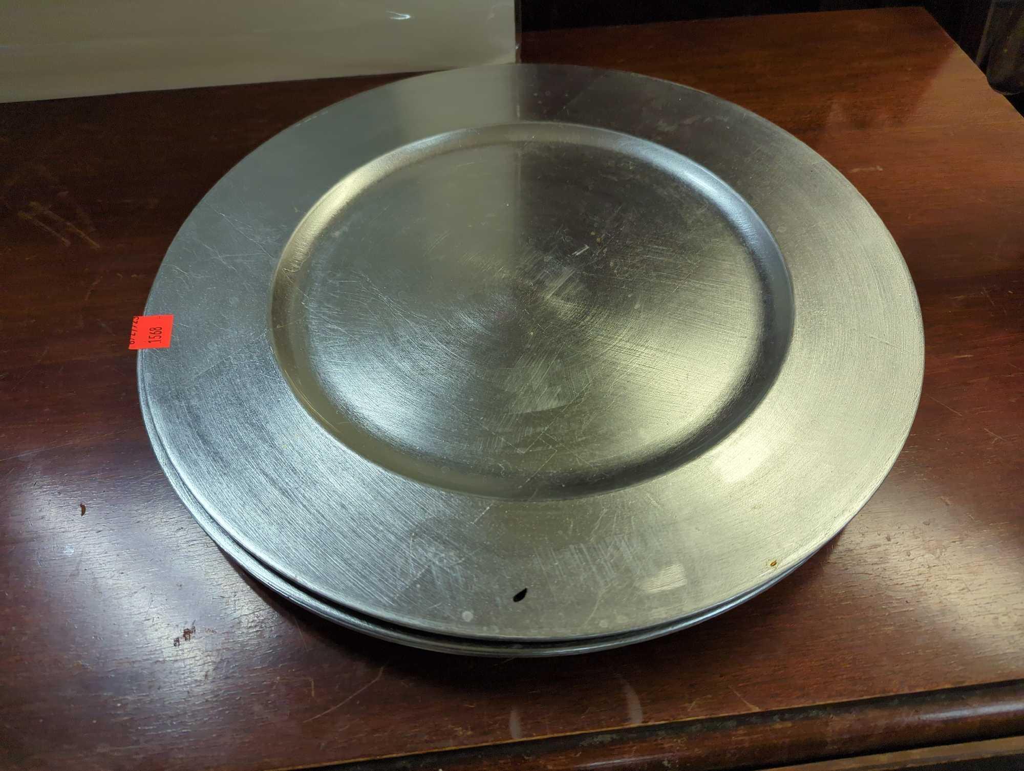 Set of 11 silver plastic charger plates. Comes as is shown in photos. Appears to be used.