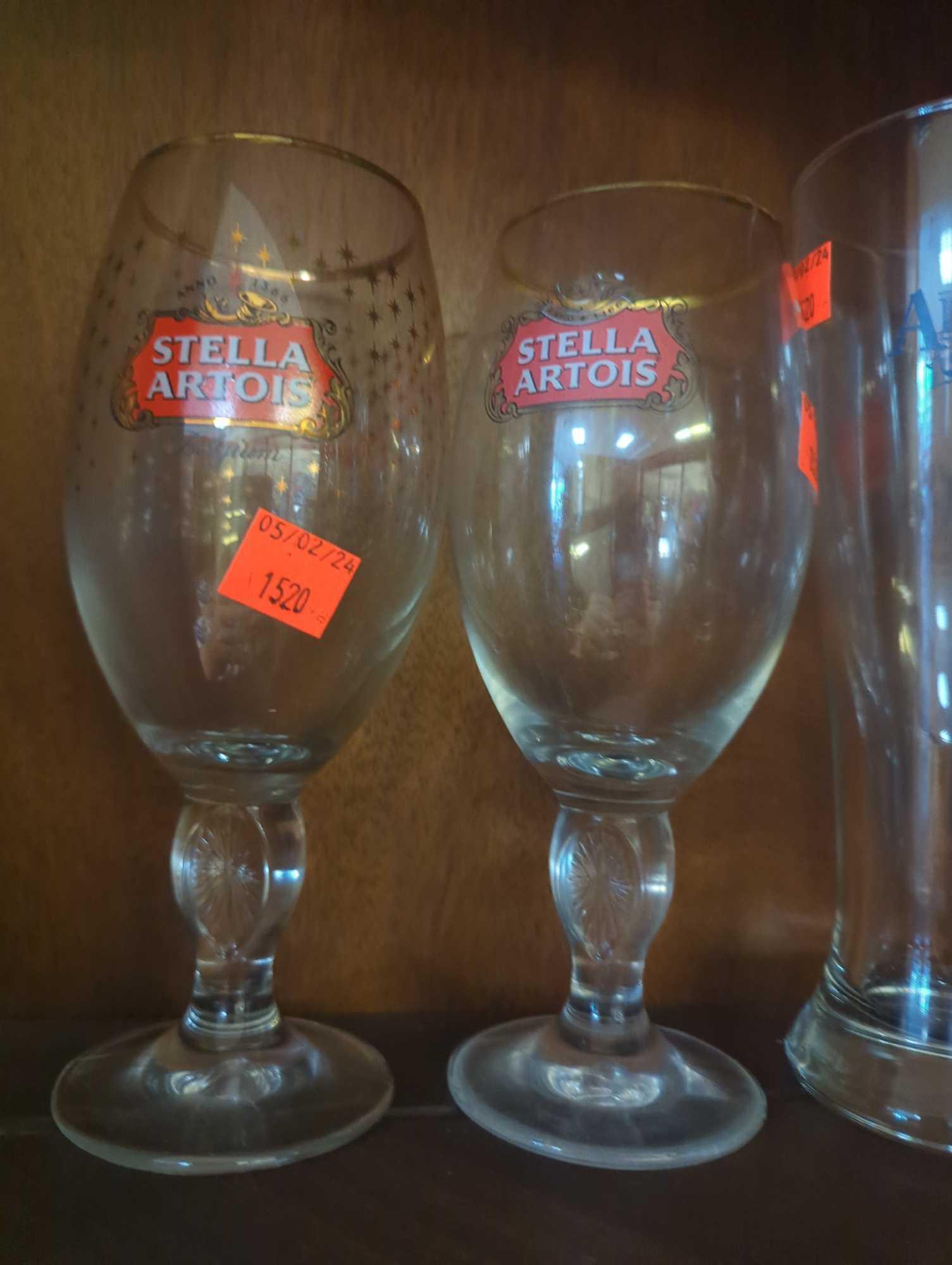 Shelf Lot of Assorted Glasses Including Wine Glasses, Beer Mugs, Tulip Glasses, Etc...What You See