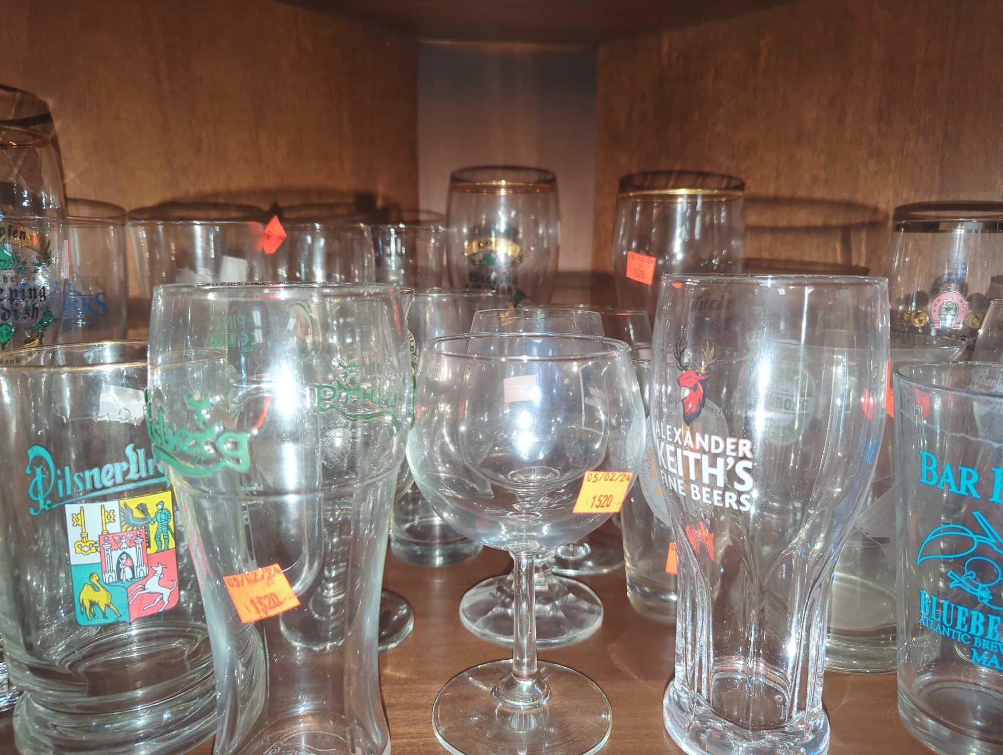 Shelf Lot of Assorted Glasses Including Wine Glasses, Beer Mugs, Tulip Glasses, Etc...What You See