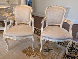 PAIR OF SILIK MINERVA ARM CHAIRS WITH NICE FLORAL CARVED DETAILING. THESE CHAIRS RETAIL FOR $4,800.