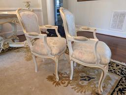 PAIR OF SILIK MINERVA ARM CHAIRS WITH NICE FLORAL CARVED DETAILING. THESE CHAIRS RETAIL FOR $4,800.