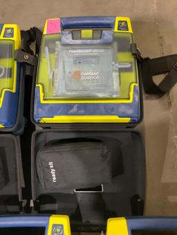 4 CARDIAC SCIENCE AUTOMATED EXTERNAL DEFIBRILLATORS & 1...CARDIAC SCIENCE AED TRAINER