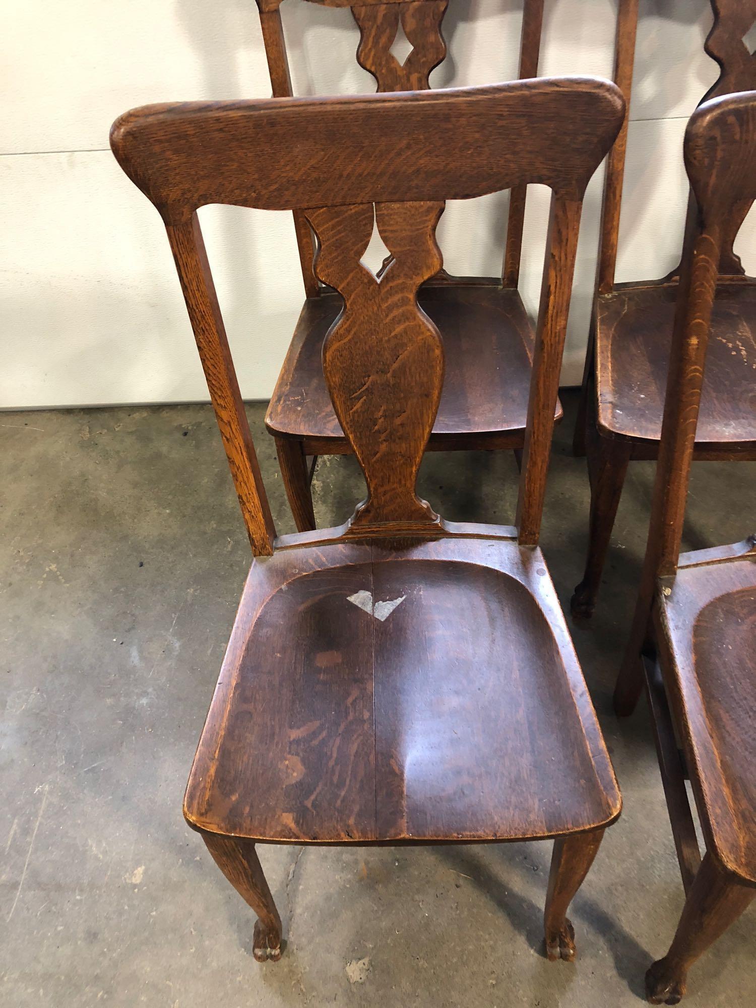 4 matching Stomps Burkhardt oak clawfoot kitchen chairs