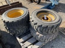 (510) - (4)SKID STEER TIRES/RIMS