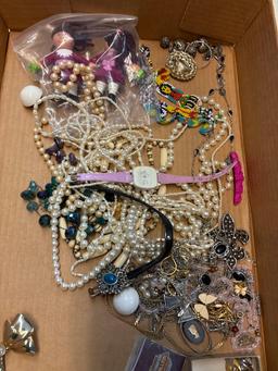 Three flats of jewelry