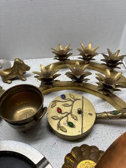 brass items mask horoscope ashtray candlesticks door knocker etc.