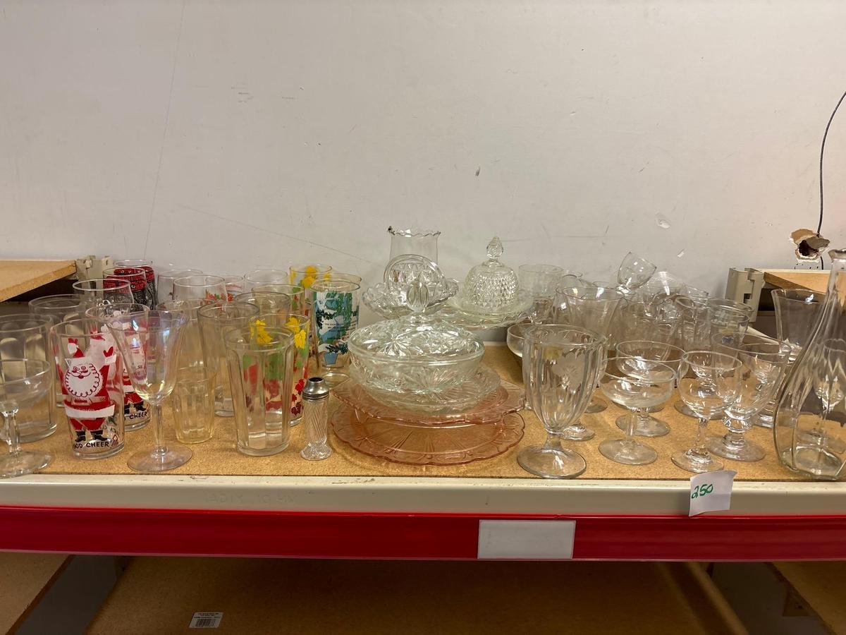 contents of shelf advertising glasses pink depression ware cake Cake