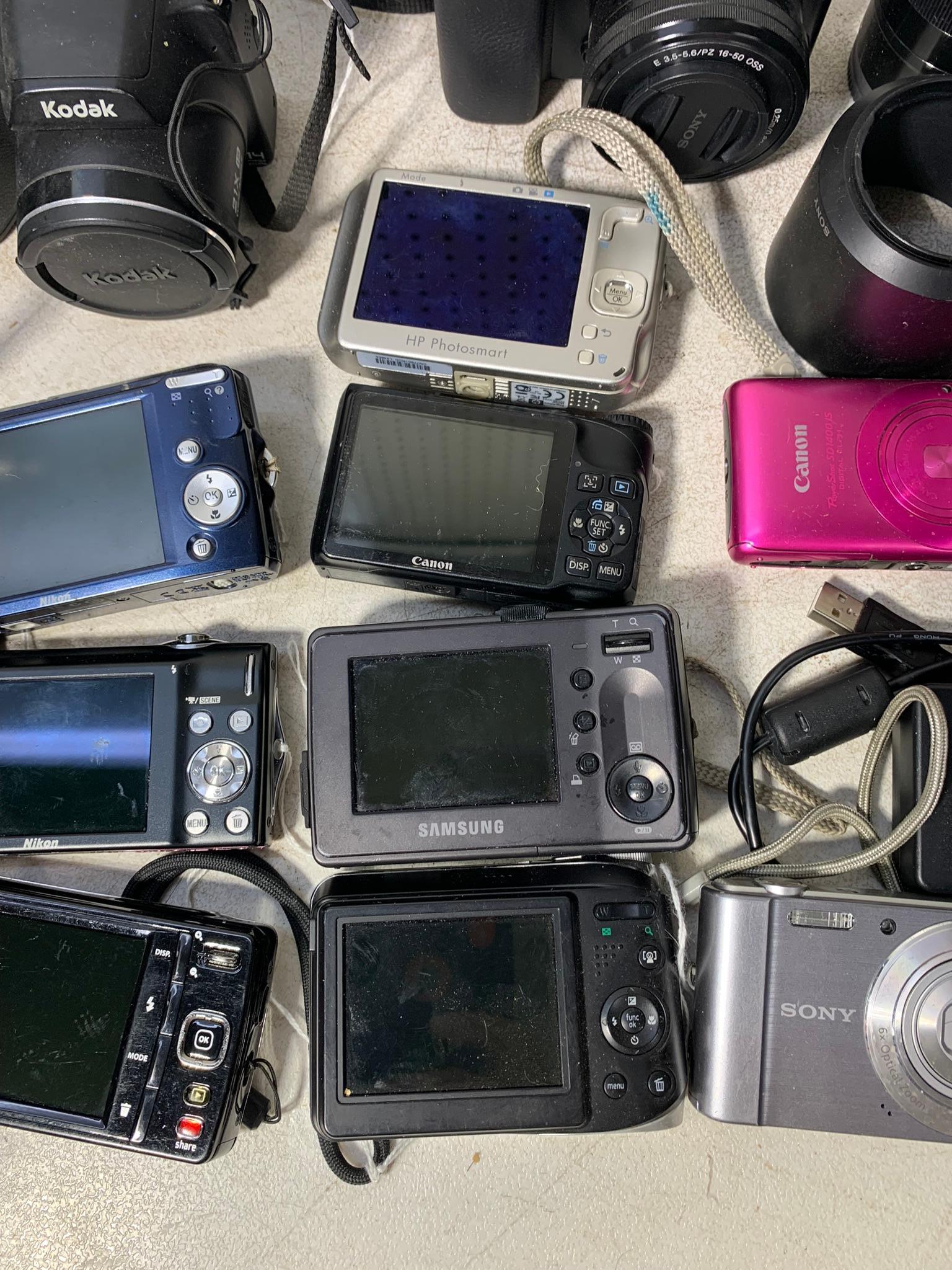 Assortment of Digital Cameras, Chargers & More