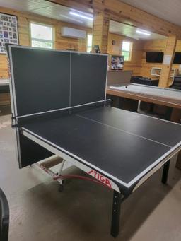 Stigna regulation size portable ping pong table.