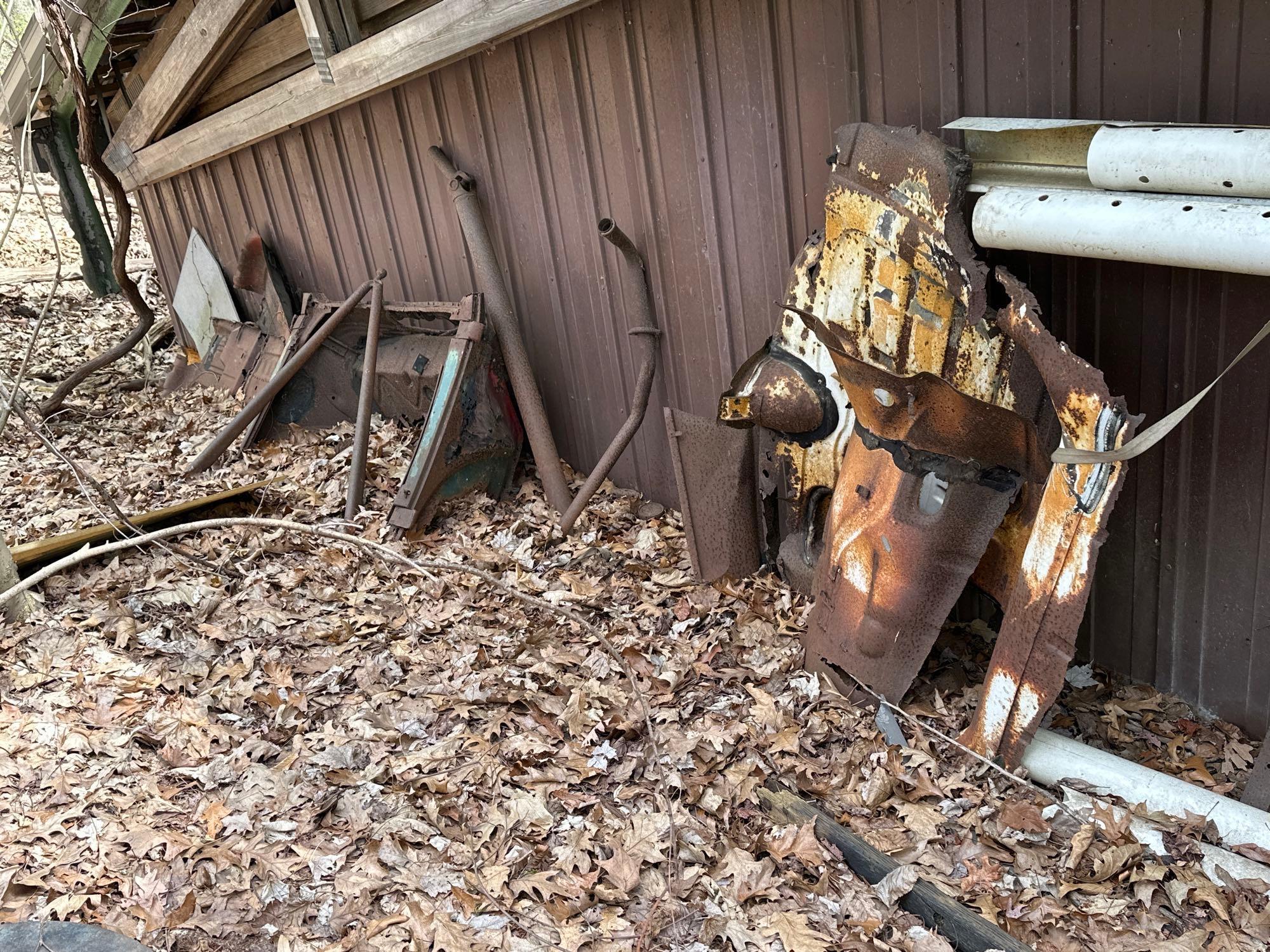 air conditioner - grease can - iron and parts behind garage