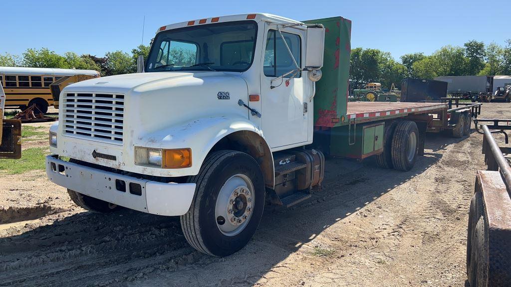 *2000 International 4700 T444E Roll-Back Flatbed