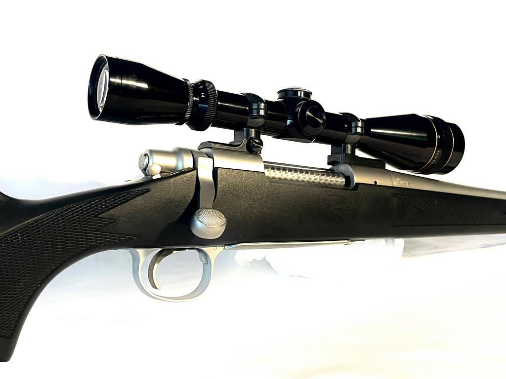 Remmington Model 700 7MM Rem Mag. Cal. Stainless Bolt Action Rifle With 4X12 Leupold Scope