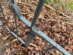 Metal Fence & Concrete Figures On House Side Of Walk